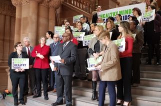 Photo courtesy of Healthy Minds, Healthy Kids,br.
Keith Little advocates for children health care while others stand behind him at the Million Dollar Staircase in the Capitol Building on Tuesday, January 28.
